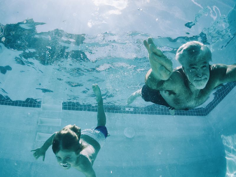 Man swims with his grandson thanks to new hearing aids that are waterproof.